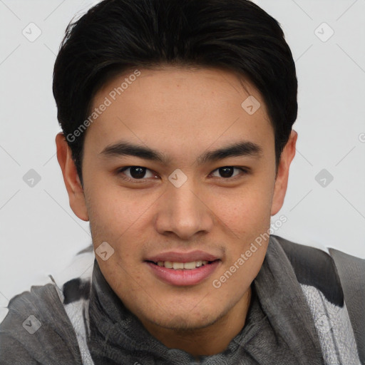 Joyful asian young-adult male with short  brown hair and brown eyes