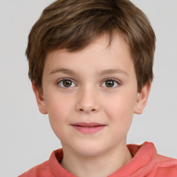 Joyful white child male with short  brown hair and brown eyes