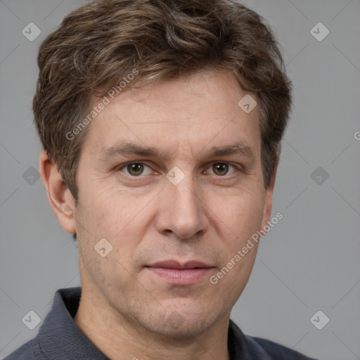 Joyful white adult male with short  brown hair and grey eyes