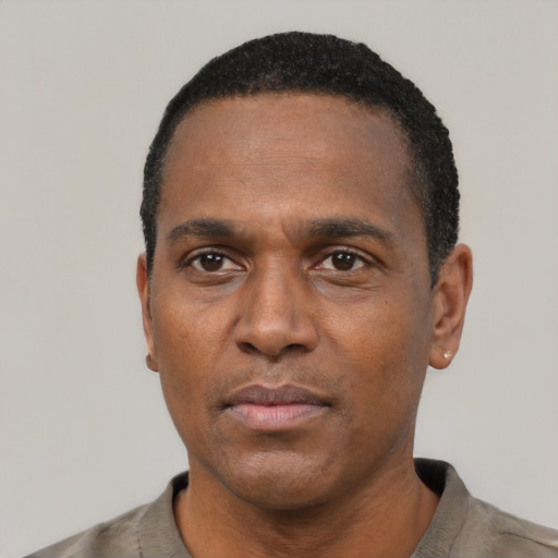 Neutral black adult male with short  black hair and brown eyes