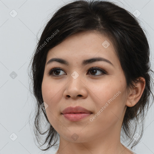 Joyful asian young-adult female with medium  brown hair and brown eyes