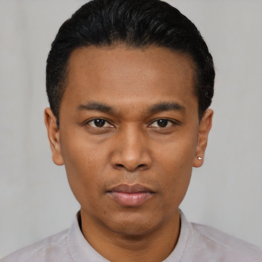 Neutral black young-adult male with short  black hair and brown eyes