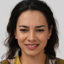 Joyful latino young-adult female with medium  brown hair and brown eyes
