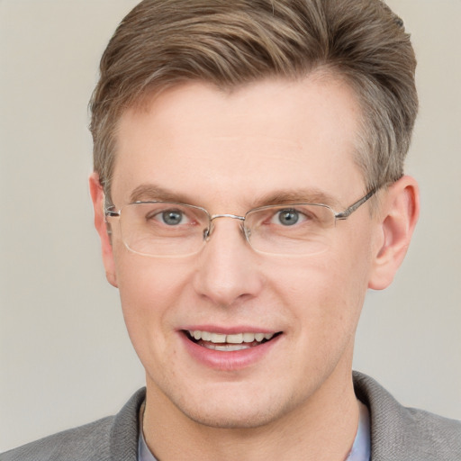 Joyful white adult male with short  brown hair and grey eyes