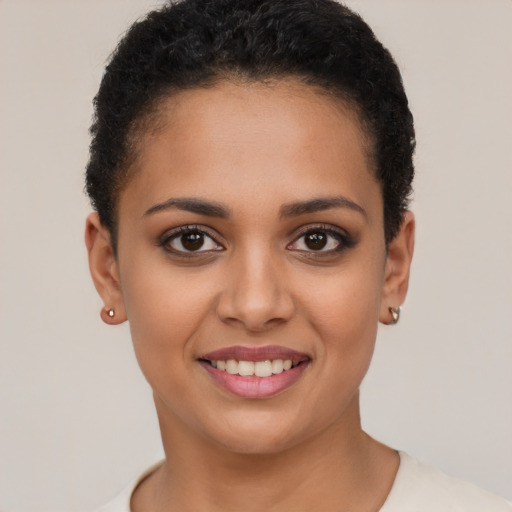 Joyful latino young-adult female with short  brown hair and brown eyes