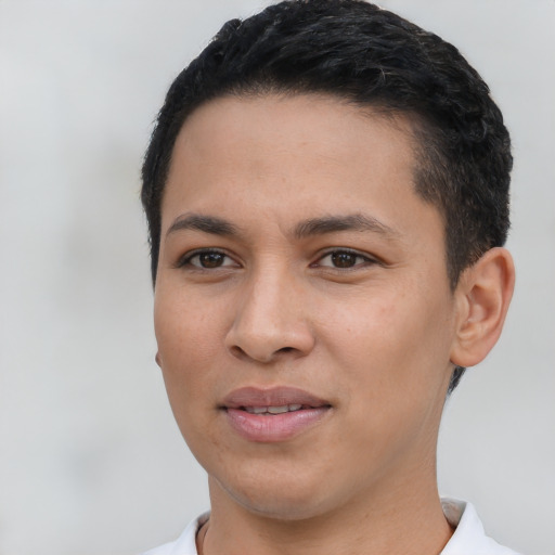Joyful latino young-adult female with short  black hair and brown eyes