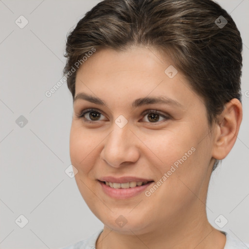 Joyful white young-adult female with medium  brown hair and brown eyes