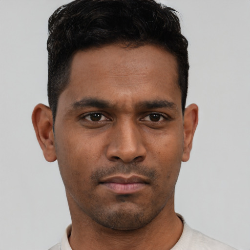 Neutral latino young-adult male with short  brown hair and brown eyes