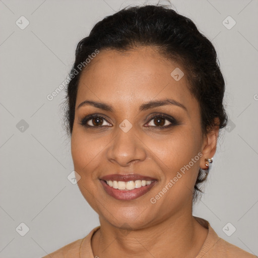 Joyful latino young-adult female with short  brown hair and brown eyes