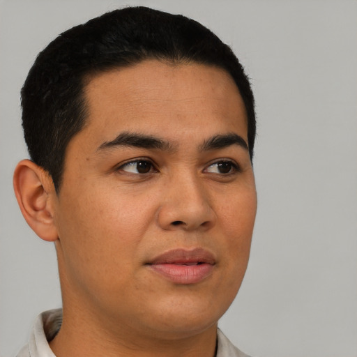 Joyful asian young-adult male with short  black hair and brown eyes