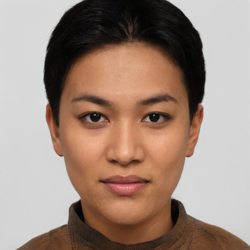 Joyful latino young-adult female with short  black hair and brown eyes