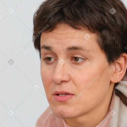 Joyful white adult female with short  brown hair and brown eyes