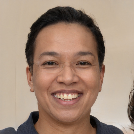 Joyful white adult female with short  brown hair and brown eyes