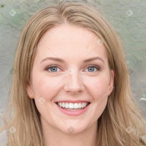 Joyful white young-adult female with long  brown hair and blue eyes