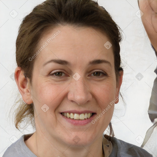 Joyful white adult female with medium  brown hair and grey eyes