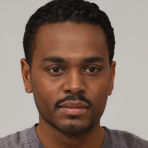 Neutral black young-adult male with short  black hair and brown eyes