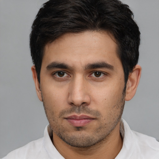 Neutral white young-adult male with short  black hair and brown eyes