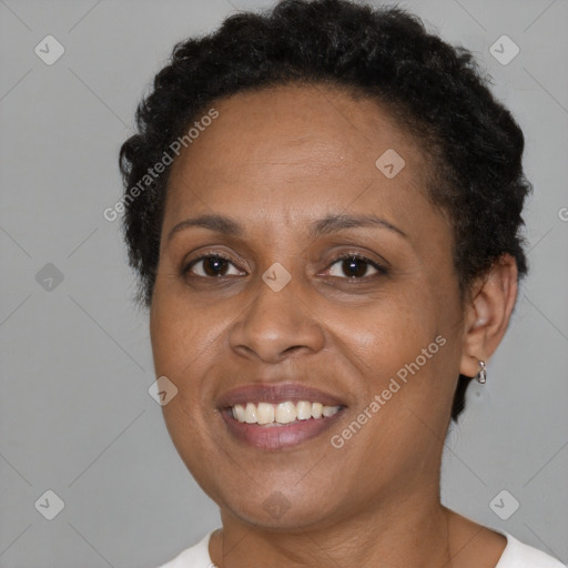 Joyful black adult female with short  brown hair and brown eyes