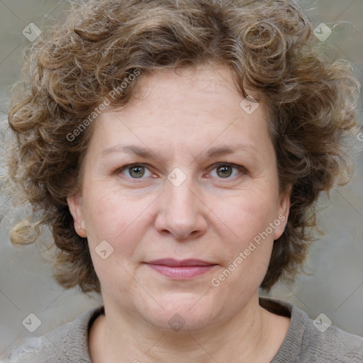 Joyful white adult female with medium  brown hair and blue eyes