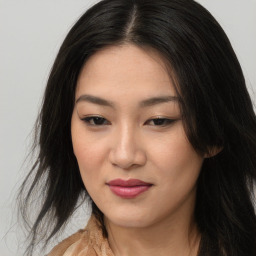 Joyful asian young-adult female with long  brown hair and brown eyes