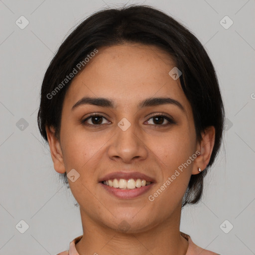 Joyful latino young-adult female with medium  brown hair and brown eyes