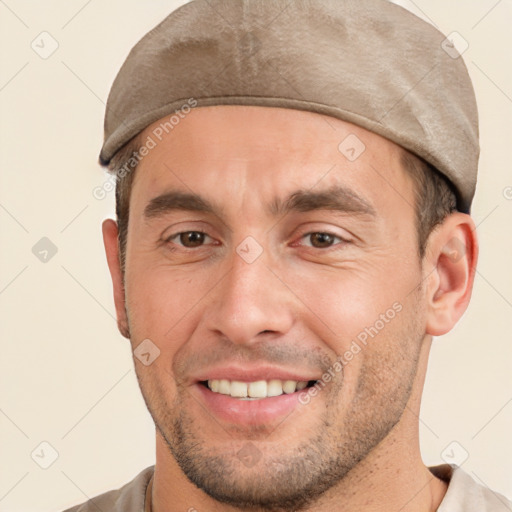 Joyful white young-adult male with short  brown hair and brown eyes