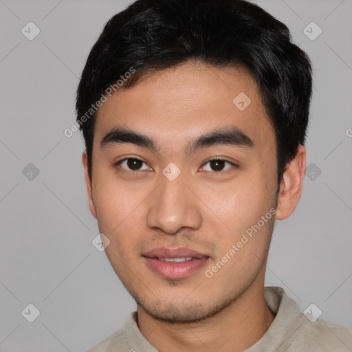 Joyful asian young-adult male with short  black hair and brown eyes