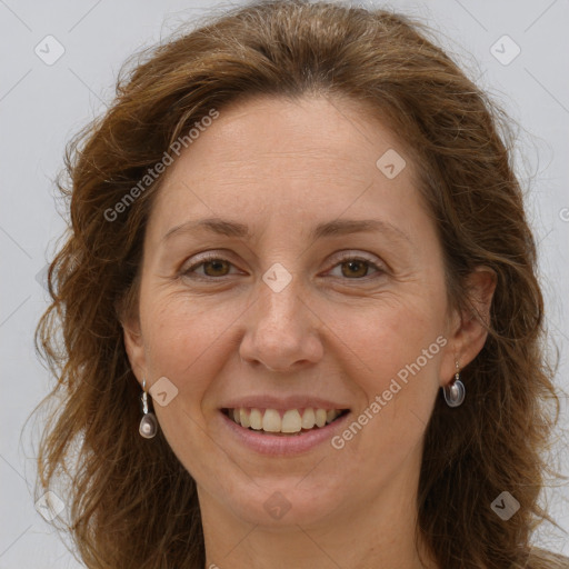 Joyful white adult female with long  brown hair and grey eyes