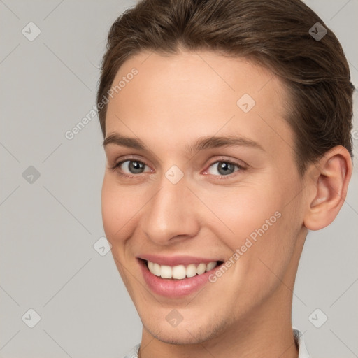 Joyful white young-adult female with short  brown hair and brown eyes