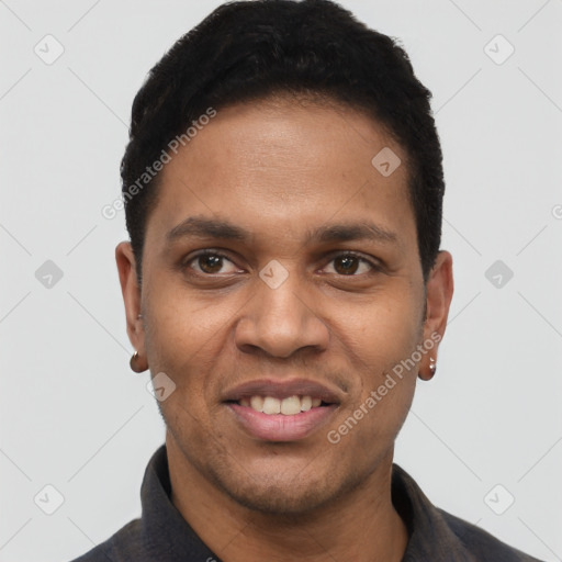 Joyful black young-adult male with short  black hair and brown eyes