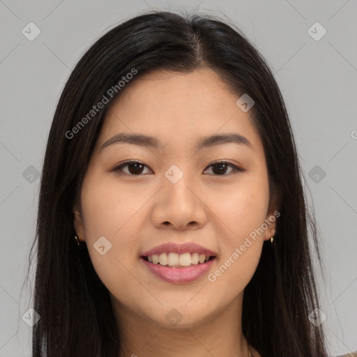 Joyful asian young-adult female with long  brown hair and brown eyes