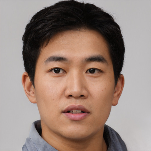 Neutral asian young-adult male with short  black hair and brown eyes