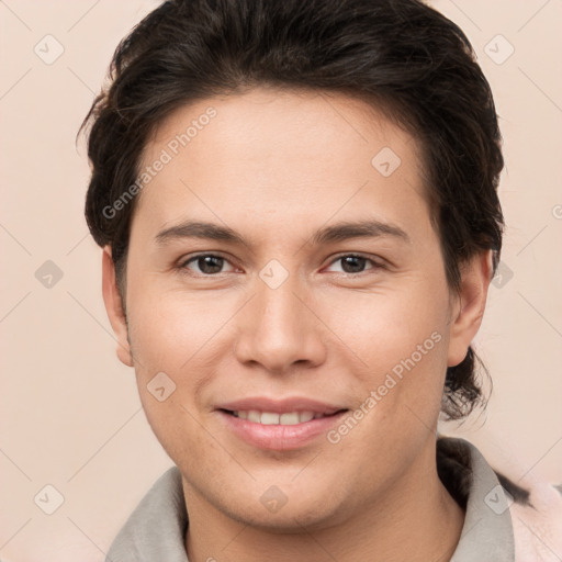 Joyful white young-adult female with short  brown hair and brown eyes