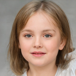 Joyful white child female with medium  brown hair and blue eyes