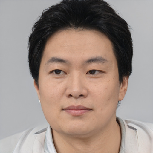 Neutral asian young-adult male with short  black hair and brown eyes