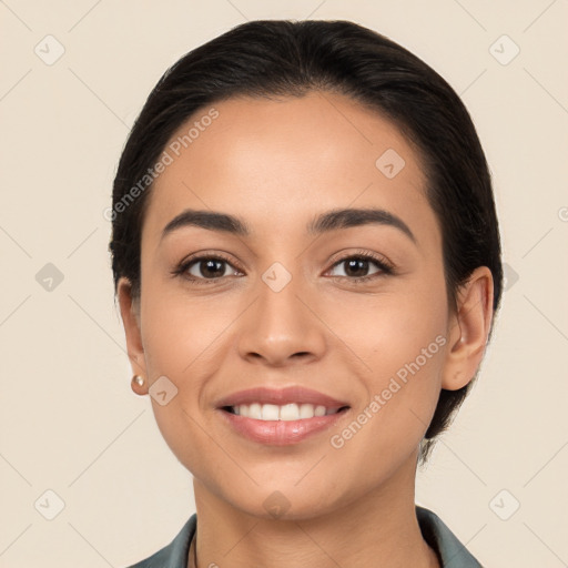 Joyful white young-adult female with long  black hair and brown eyes