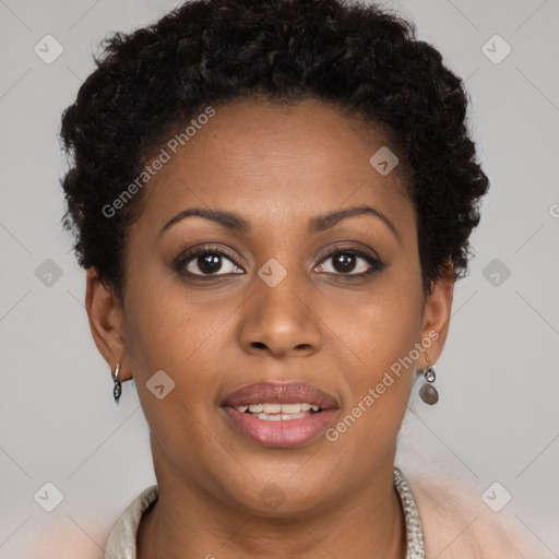 Joyful black young-adult female with short  brown hair and brown eyes