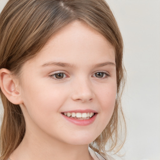 Joyful white child female with medium  brown hair and brown eyes