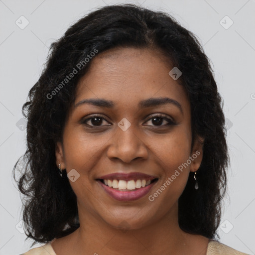 Joyful black young-adult female with long  brown hair and brown eyes