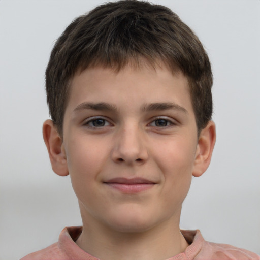 Joyful white child male with short  brown hair and grey eyes