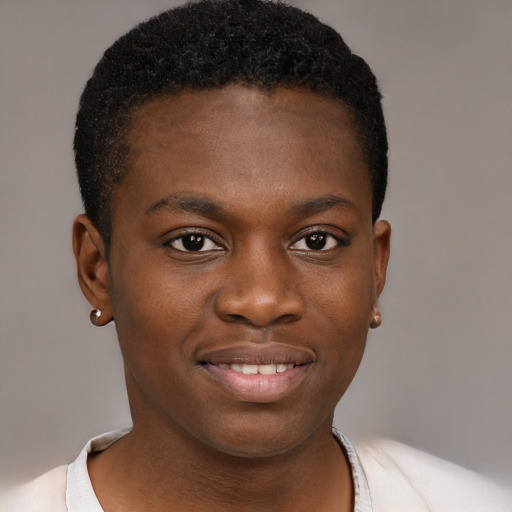 Joyful black young-adult male with short  brown hair and brown eyes
