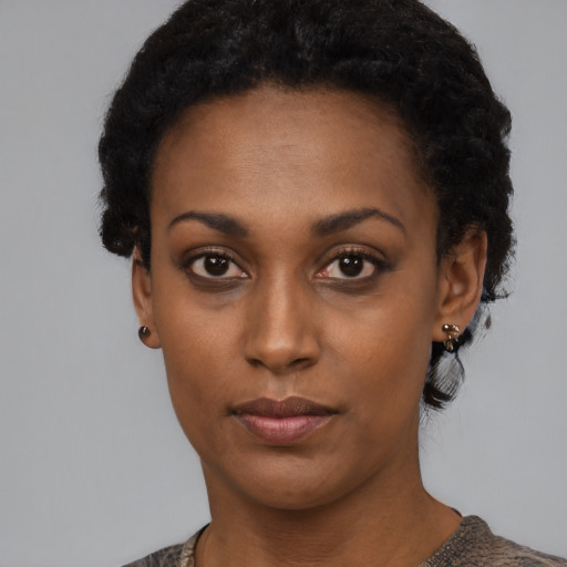 Neutral black young-adult female with short  black hair and brown eyes