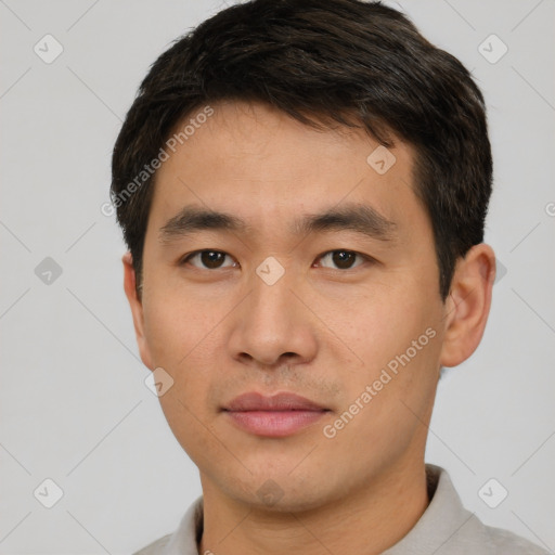 Neutral asian young-adult male with short  brown hair and brown eyes