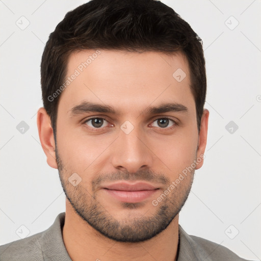 Joyful white young-adult male with short  brown hair and brown eyes