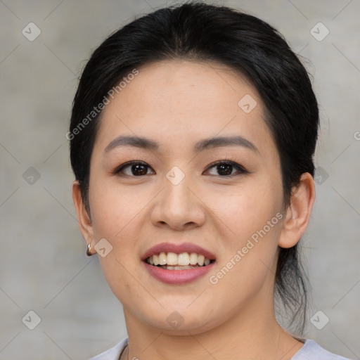 Joyful asian young-adult female with medium  black hair and brown eyes