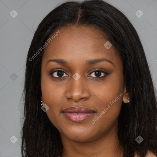 Joyful black young-adult female with long  brown hair and brown eyes