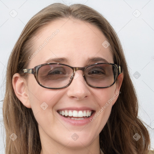 Joyful white young-adult female with long  brown hair and blue eyes