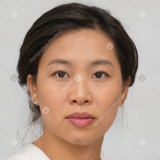 Joyful asian young-adult female with short  brown hair and brown eyes