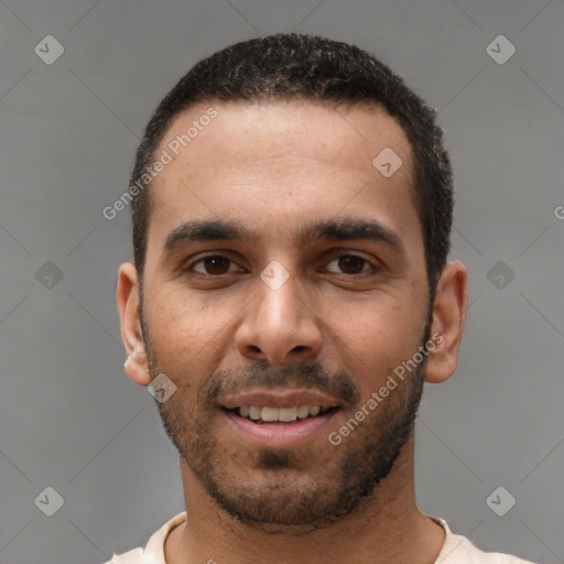 Joyful white young-adult male with short  black hair and brown eyes