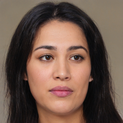 Joyful white young-adult female with long  brown hair and brown eyes